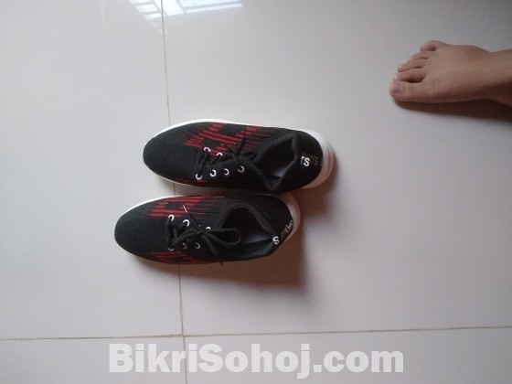 Black and red shoe